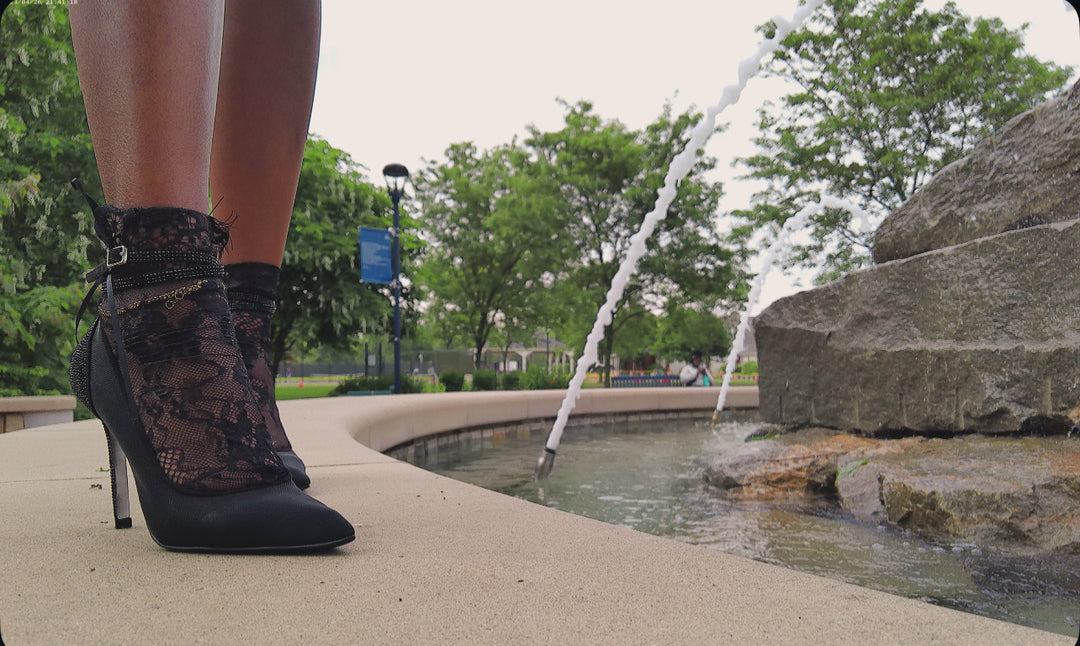 Side view of black lace ankle socks styled with platform heels – breathable, feminine accessory for chic looks