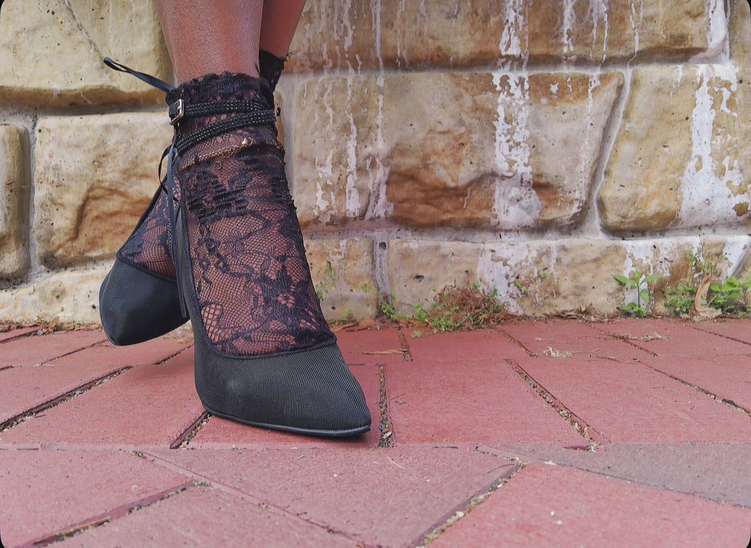 Front view of black lace ankle socks worn with heels – soft, lacy design adds glam to any ou