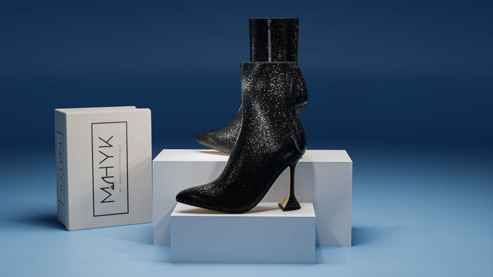 Generated image of glitter black ankle boot, side view displaying sparkling surface, sleek silhouette, and ankle height.