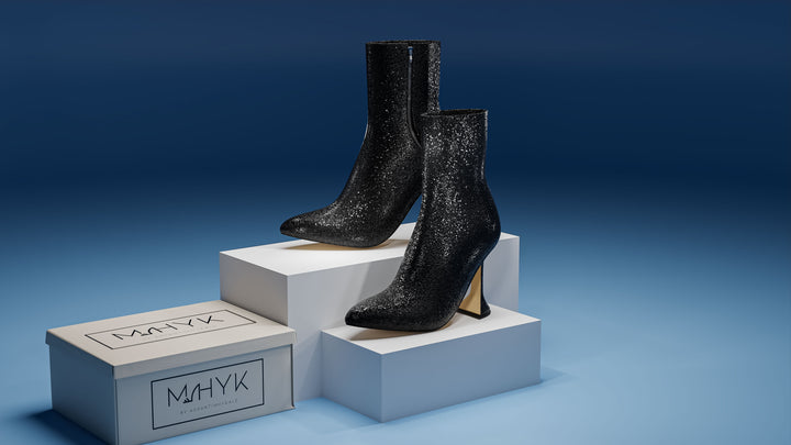 Generated image of glitter black ankle boot, alternate side view highlighting textured glitter finish and heel desi